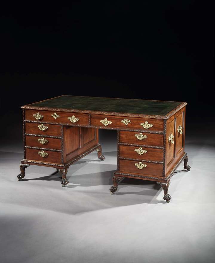 A GEORGE II MAHOGANY PEDESTAL WRITING DESK ATTRIBUTED TO WILLIAM HALLETT